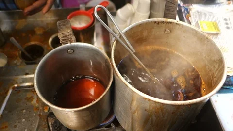 Boiling-hot-tea-decoction-tea-stall-india Stock Footage 98084832