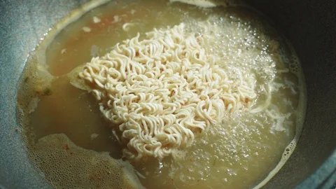 Boiling instant noodle in pan pot Stock Footage 97607497