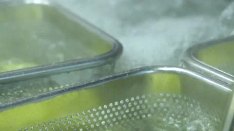 Boiling Italian spaghetti in hot pan steam water. Professional kitchen for pasta Stock Footage 150590729