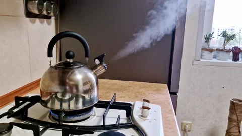 Boiling Kettle Emitting Jet of Steam on Stove Stock Footage 320430040
