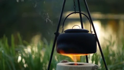 Boiling kettle on the fire outdoor Stock Footage 81756063