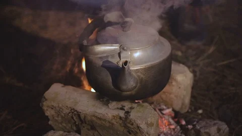 Boiling kettle on the fire outdoor Video stock 104409832