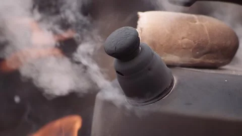 Boiling kettle at fire vapor close up Video stock 243400134