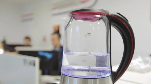 Boiling kettle in the office room Stock Footage 123275343