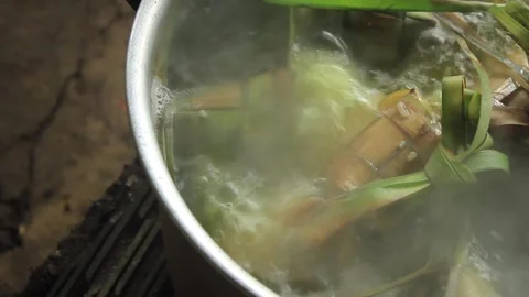 Boiling Ketupat in a pot Stock Footage 277121774