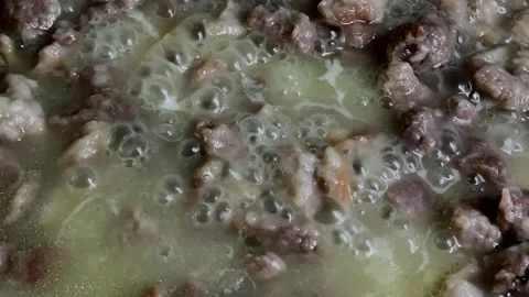 Boiling liquid with blades.soup with bubbles Video stock 195722054