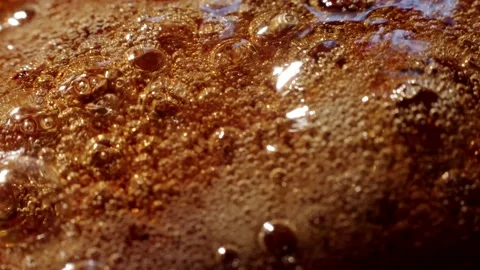 Boiling liquid caramel Stock Footage 150875283