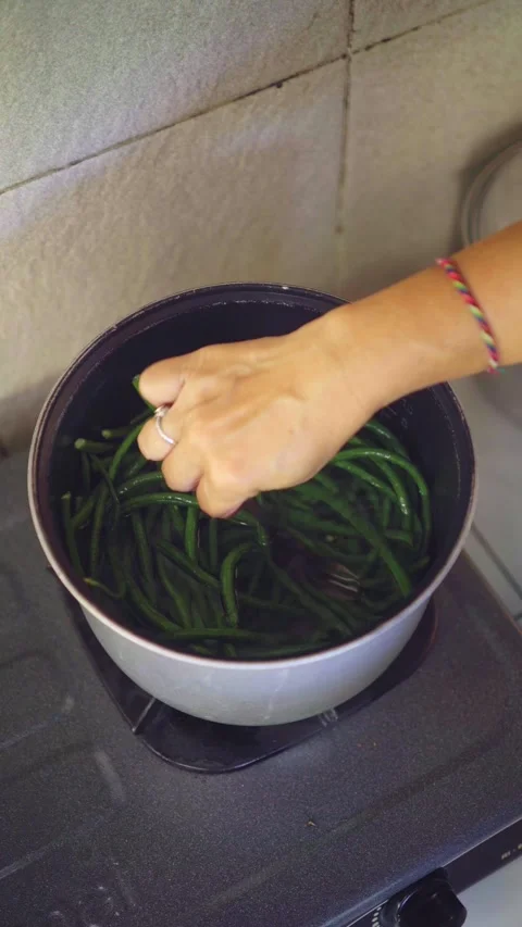 Boiling Long Beans in hot water Stock Footage 337079252