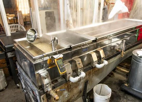 Boiling maple syrup sap boiling pans with steam Stock-Fotos