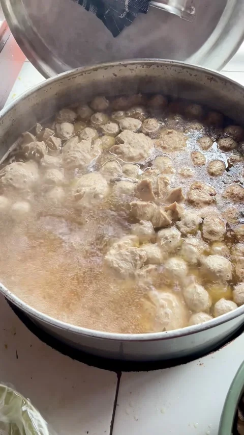 Boiling meatballs in an open hot pot  Stock Footage 295122245