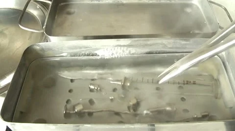Boiling medical instruments before use Stock Footage 10789978