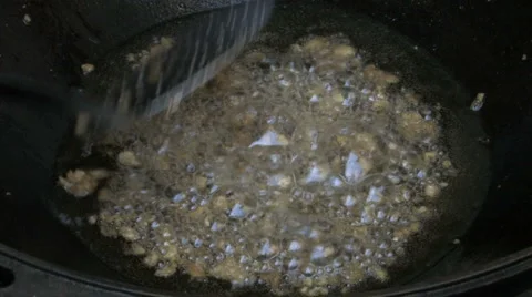 Boiling melted fat in Wok Stock Footage 960376