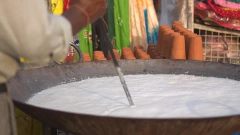 Boiling Milk in Traditional Indian Kitchen Stock Footage 321025525