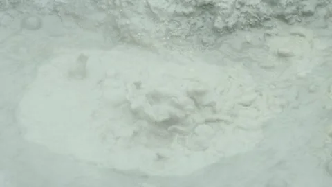 Boiling mud bubbles and hot steam in geyser 動画素材 319907937
