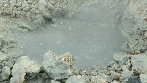 Boiling mud bubbles and hot steam in geyser Stock Footage 319907979