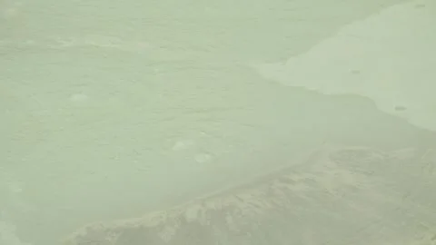 Boiling mud bubbles and hot steam in geyser Stock Footage 319907989