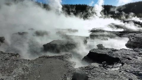 Boiling mud bubbling in steaming landscape, Drone slowly flying over geothermal Stock Footage 307599944