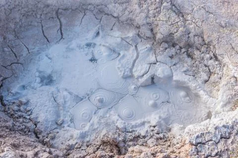 Boiling mud of fumaroles Stock Photos