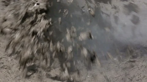 Boiling mud pool with violent explosion Stock Footage 44751532