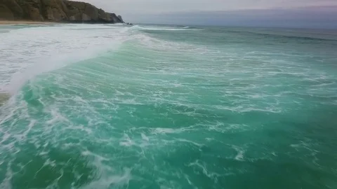 Boiling ocean waves rolling on the deserted shore Stock Footage 76839656