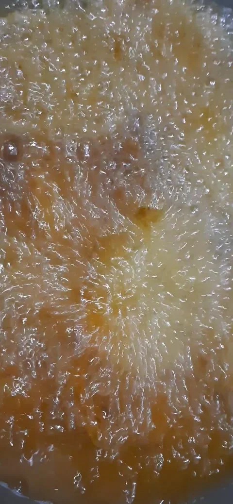 Boiling Oil Murukku Preparation Capturing the Crispy Frying Process Stock Footage 284315164