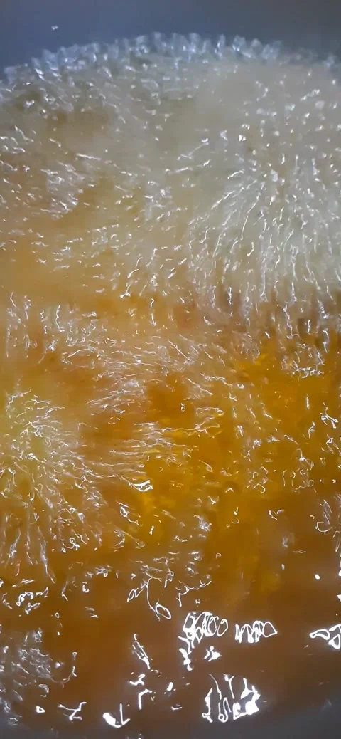 Boiling Oil Murukku Preparation Capturing the Crispy Frying Process Stock Footage 284315168