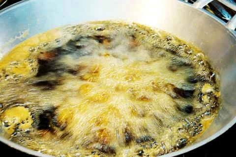 Boiling oil in pan. Stock Photos