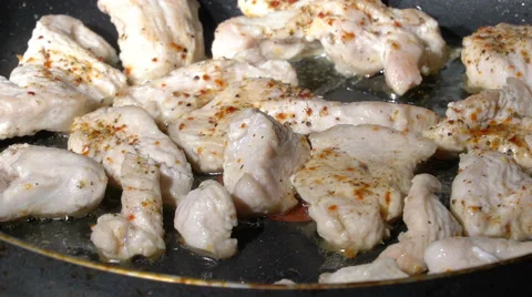 Boiling oil under almost ready turkey meat Stock Footage 60057037