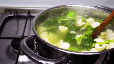 Boiling orecchiette and cime di rape Stock Footage 294998517