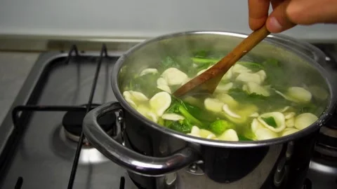 Boiling orecchiette and cime di rape Stock Footage 298964397