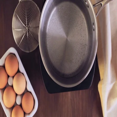 Boiling organic eggs for deviled eggs recipe. Video stock 69729716