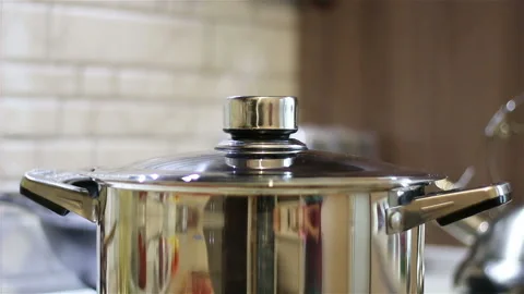 Boiling pan on the stove Stock Footage 155983982