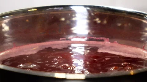 Boiling pomegranate juice Stock Footage 99315399