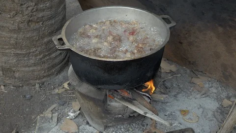 Boiling pork to make a fat outdoors household ( close up) Stock Footage 90423634