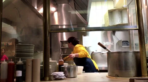 Boiling pork soup in the pot inside a restaurant kitchen. Stock Footage 57568785