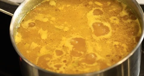 Boiling In A Pot Of Pumpkin Soup Stock Footage 107392221
