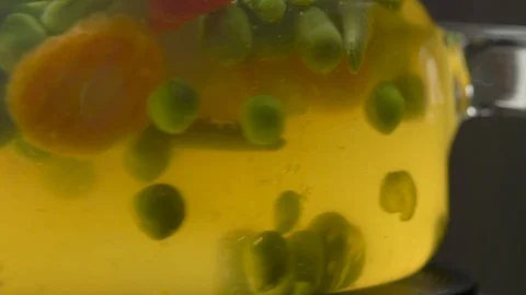 A boiling pot of vegetable soup on the stove Stock Footage 108173675