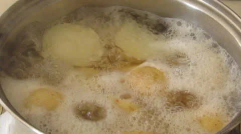 Boiling potatoes HD Stock Footage 25569588