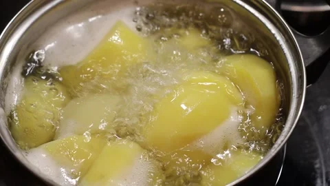 Boiling potatoes in a pan Stock Footage 147937587