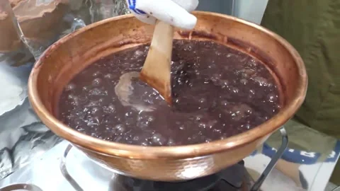 Boiling Red Bean Paste Simmering in Traditional Copper Pot Stock Footage 345292239