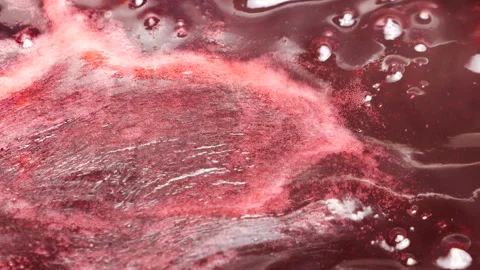 Boiling red currant jam bubbles in a saucepan Stock Footage 337942014