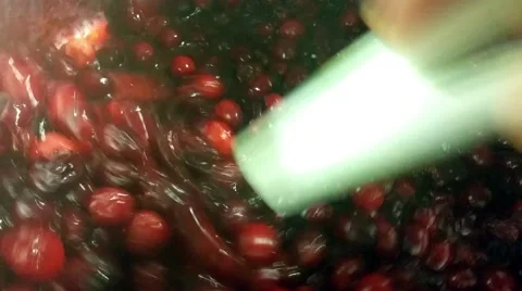 Boiling red fresh cranberries, inside a pot, at a restaurant kitchen Stock Footage 57369966