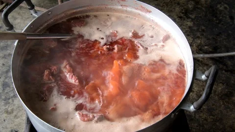 Boiling red pork in the pot. Stock Footage 107669381