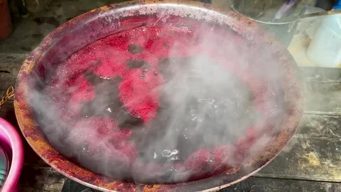 Boiling Red Purple Dye Liquid With Steam in Traditional Fabric Dyeing Stock-Footage 336721816