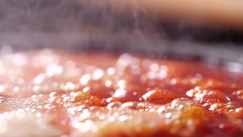 Boiling red tomato sauce in a pan with steam in 4K Resolution Stock-Footage 132227460