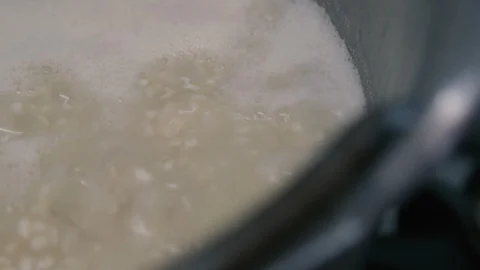 Boiling rice in a pot Stock Footage 87749087