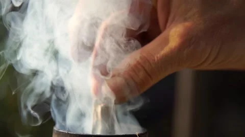 Boiling russian samovar. Man's hand puts firewood 動画素材 63156897