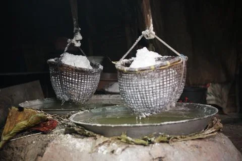 Boiling saline solution is traditional way for making mountain rock salt Stock Photos