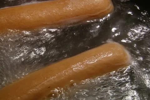 Boiling sausages. Stock Footage 20505388