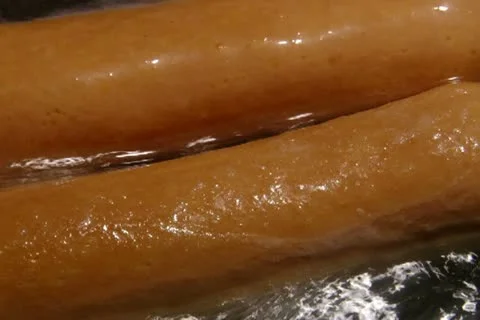 Boiling sausages. Stock Footage 20505390